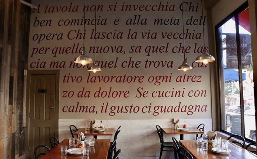 Il Casaro dining room with Italian writing on the wall